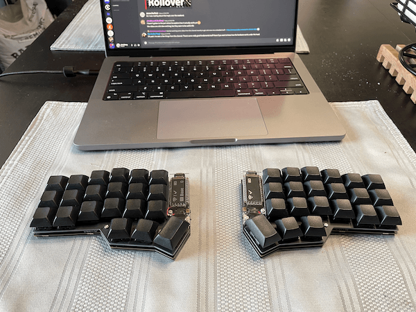 corne keyboard with my macbook and trackpad on my table